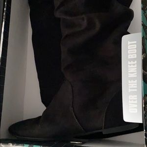 Over the knee black boots
